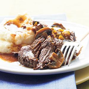 This slow cooker beef pot roast is ideal comfort food served with mashed potatoes to soak up the sauce